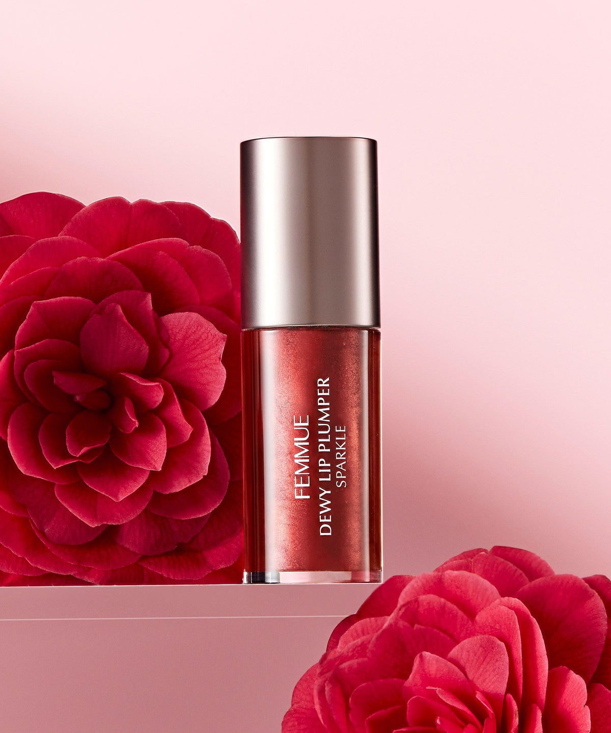 FEMMUE Dewy Lip Plumper - Sparkle Camellia with camellia flowers