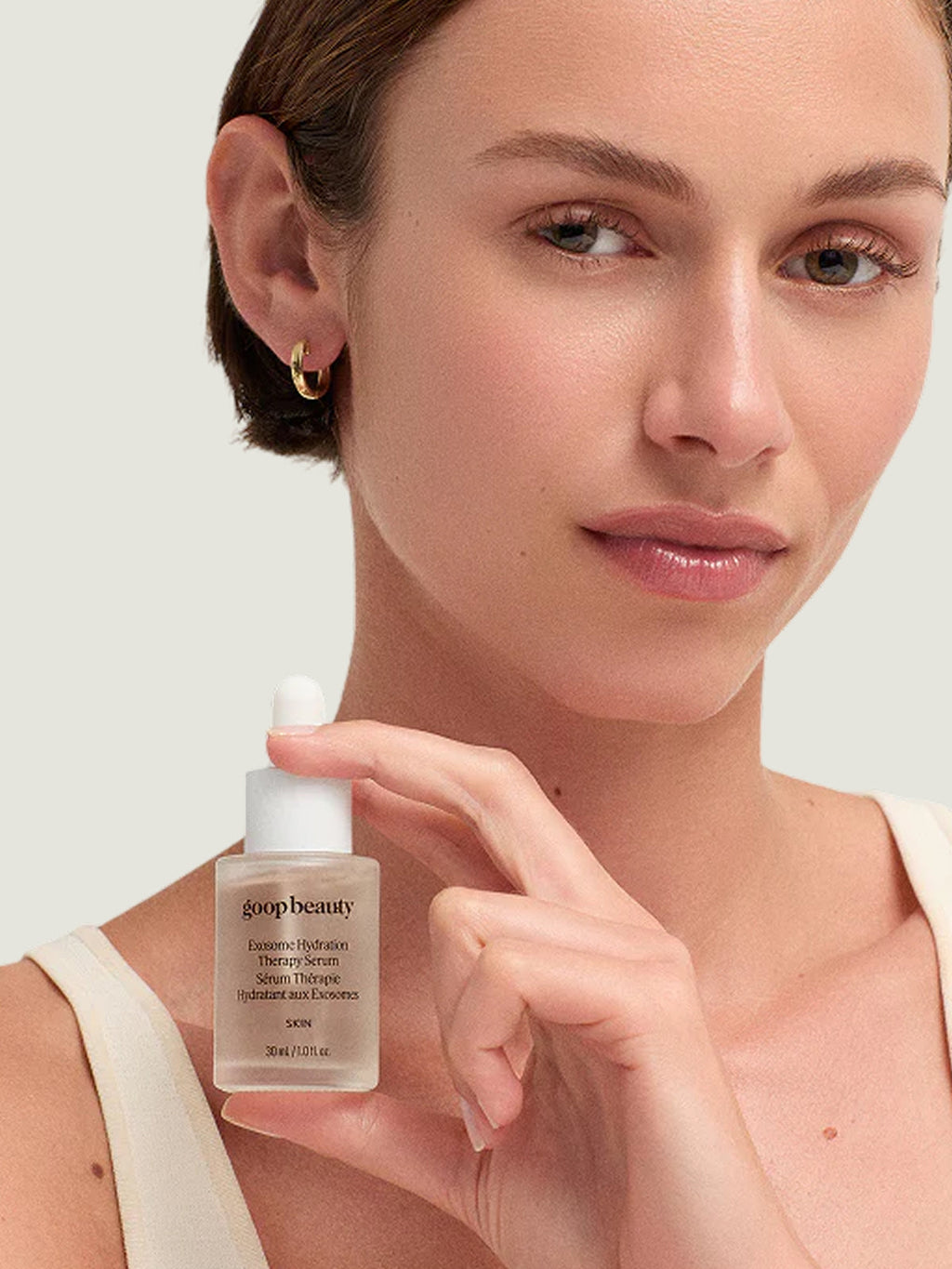 Goop Beauty Exosome Hydration Therapy Serum held in hand